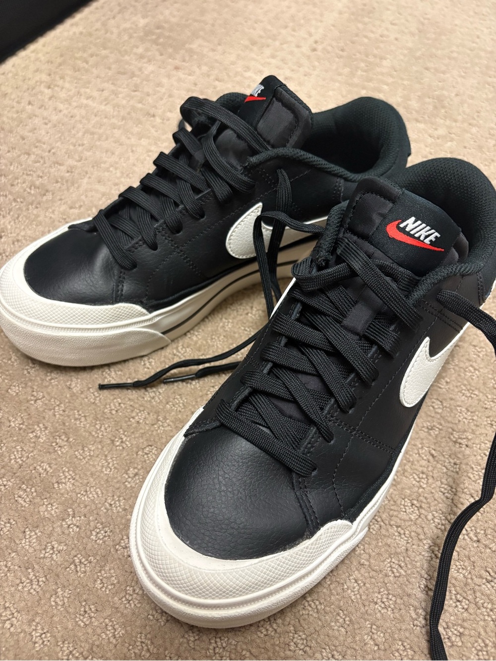 Nike Women's Black Leather Low-Top Sneakers with White Swoosh